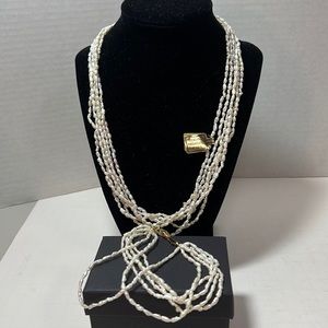Women’s Fresh Water Pearl necklace and bracelet set. Gold clasp on both.
